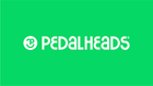Pedalheads logo featuring a white smiling face inside a circle next to the word “Pedalheads” in bold white letters on a bright green background.