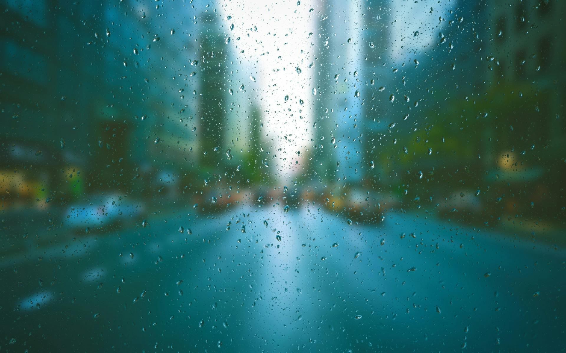 Raindrops on a window overlooking a blurred city street — symbolizing Money-Lead’s perspective of bringing clarity and focus amid financial complexity and uncertainty.